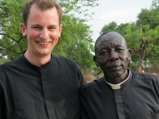 One of the clerics in this picture decided it was just too hot to wear a collar.